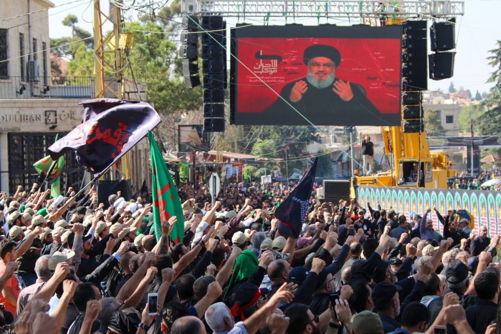 Shiite Muslims watch a televised speech by Hassan Nasrallah, the Lebanese Shiite Hezbollah movement leader, during the Arbaeen religious festival in the city of Baalbeck in Lebanon's eastern Bekaa Valley on October 19, 2019. (AFP)