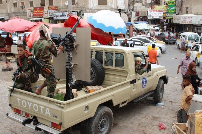 Fighters from the separatist Southern Transitional Council (STC) drive their pick up in Aden last Thursday. (AFP)