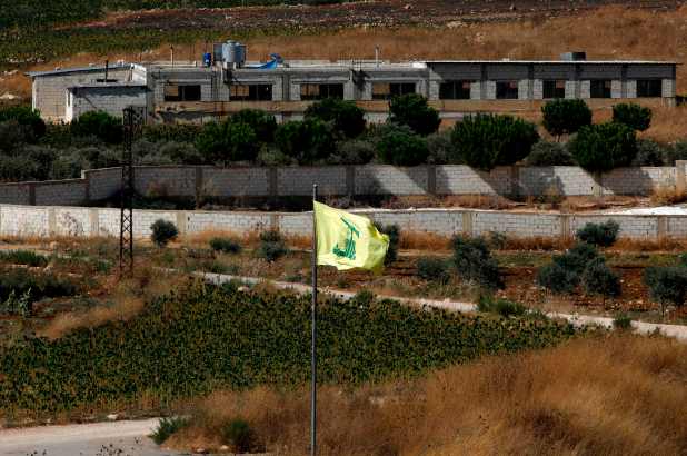 A Hezbollah flag flying in the Lebanon village of Aitaroun. (AFP)