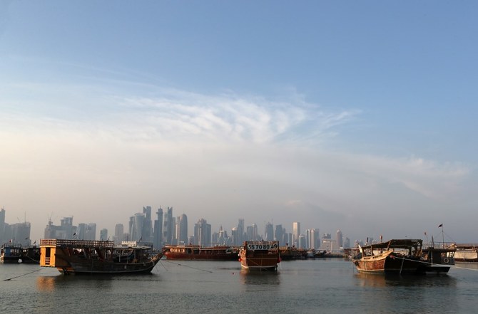 A general view shows boats moored in front of the skyline of the Qatari capital, Doha. (File/AFP)