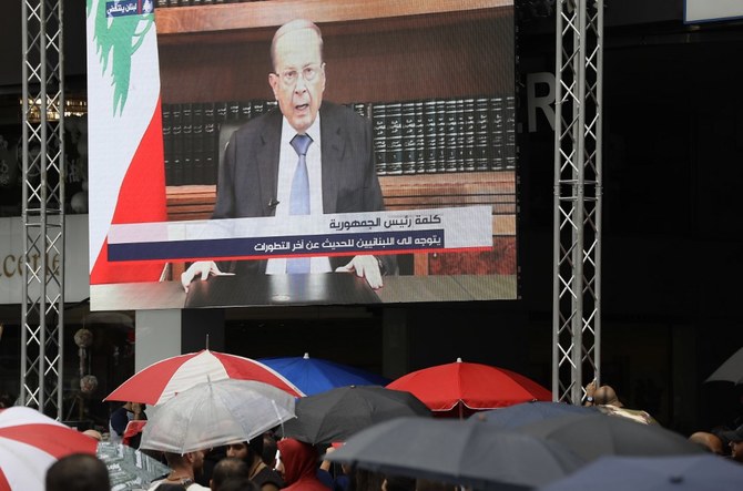 President Michel Aoun asked the cabinet to continue in a caretaker role until a new government is formed. (AFP)