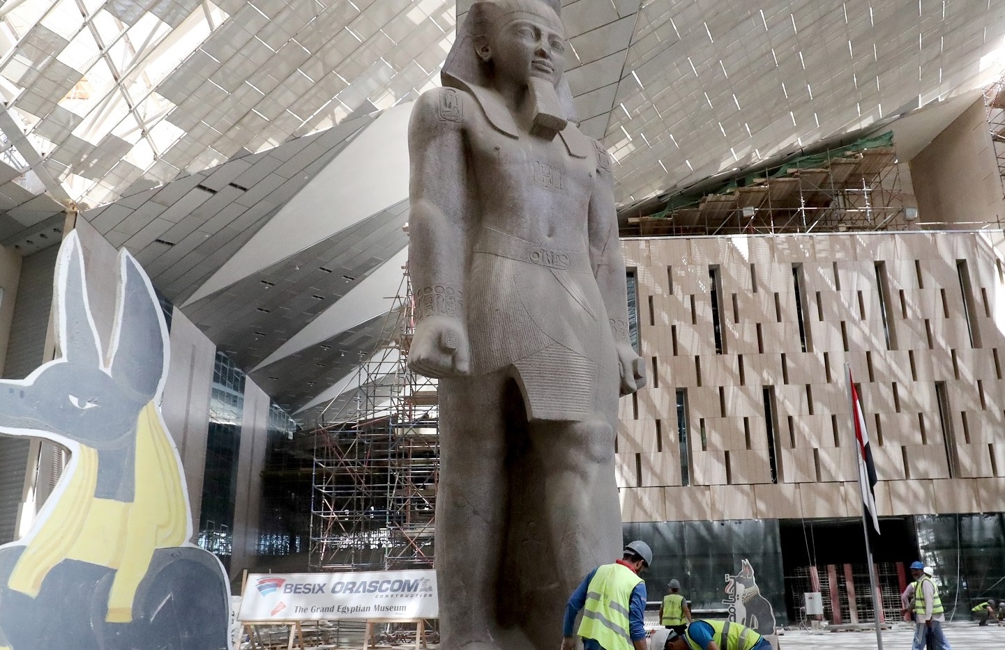This picture taken on August 4, 2019 shows the 3,200-year-old pink-granite colossal statue of King Ramses II at the entrance of the Grand Egyptian Museum under construction in Giza on the southwestern outskirts of the capital Cairo. (AFP)