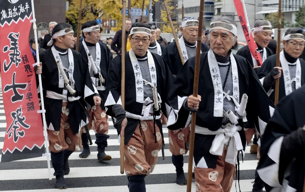 People clad in costumes of the famous “47 Samurai” march in Tokyo on December 14, 2016. (AFP)