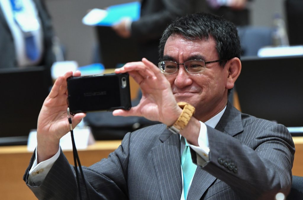 Japan’s Foreign Minister Taro Kono takes a picture during a conference on “Supporting the future of Syria and the region” at the European Council in Brussels on April 25, 2018. (AFP)