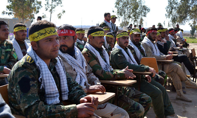 In this 2015 photo, fighters from the Iraqi Imam Ali Brigade take part in a graduation ceremony in Taza Khurmatu. (AFP file photo)