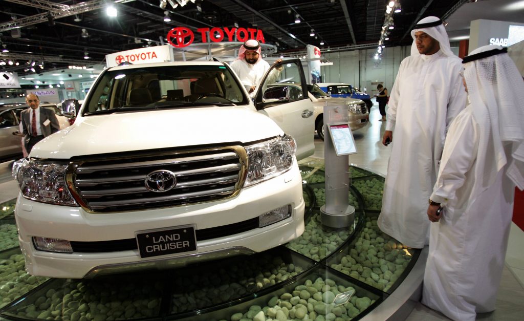 Visitors look at the new Toyota Land Cruiser during the press preview at the 9th Middle East International Motor Show in Dubai on 15 November 2007. (File photo/AFP)