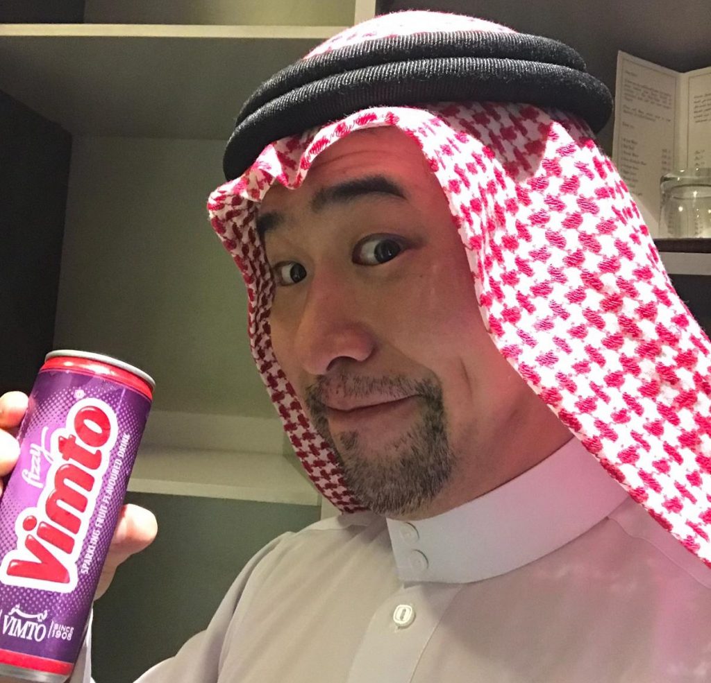 Akira Takatoriya drinking Vimto, arguably the most popular drink in the Arab world. (Supplied)