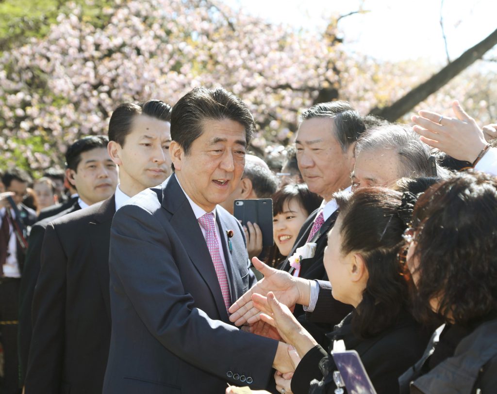 Abe is accused of, among other things, using taxpayer money for his own interest by inviting many of his supporters to the prime minister-hosted parties. (AFP)