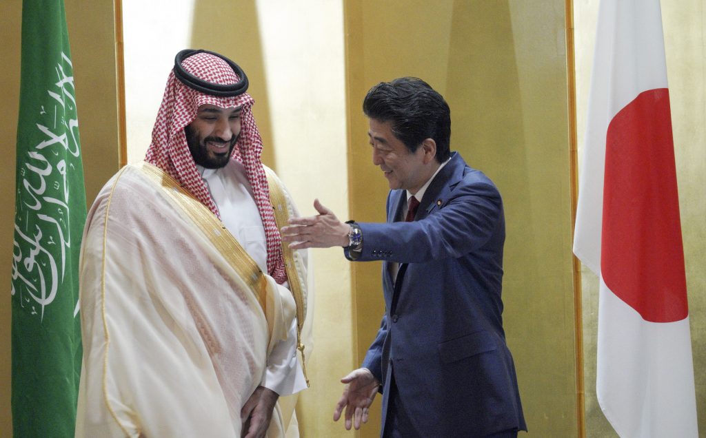 Saudi Arabia's Crown Prince Mohammed bin Salman (L) is escorted by Japanese Prime Minister Shinzo Abe during their meeting in Osaka on June 30, 2019. (AFP)