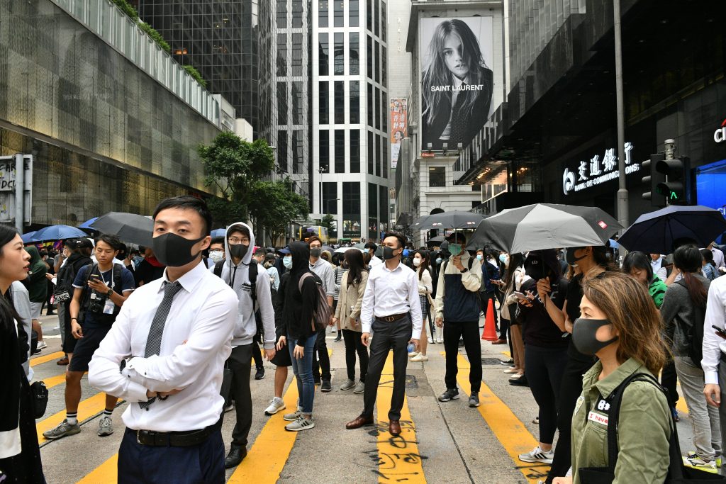 The man was held on Sunday near Hong Kong Polytechnic University in the Kowloon district, where the clash between protesters and police is continuing. (AFP)