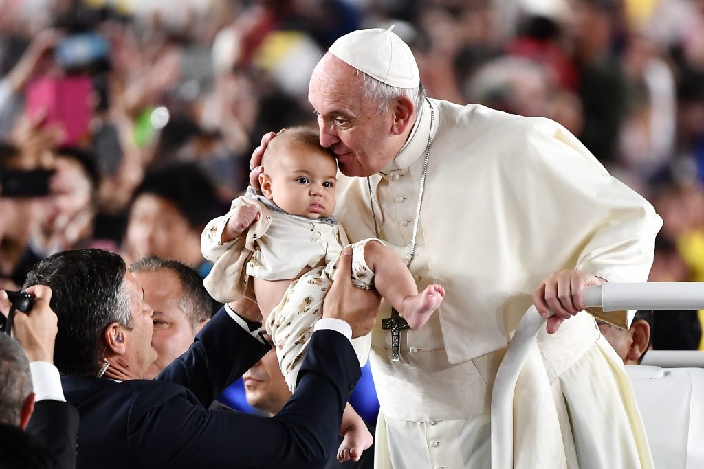 Pope Francis waves upon his arrival for a holy mass at the Tokyo Dome stadium in Tokyo on November 25, 2019. (AFP)