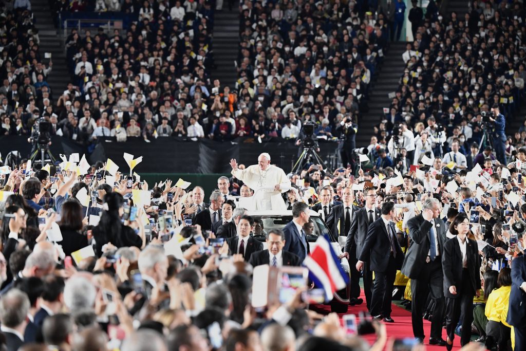 Pope Francis waves upon his arrival for a holy mass at the Tokyo Dome stadium in Tokyo on November 25, 2019. (AFP)