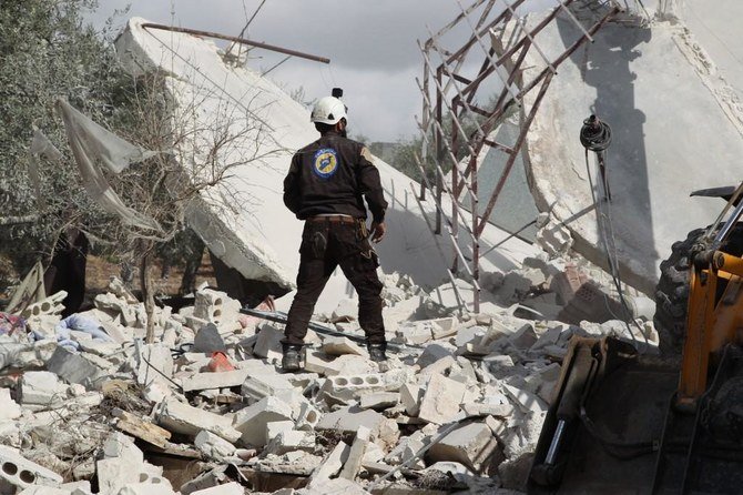 Syrian Civil Defence (White Helmets) take part in a search for victims of a Russian airstrike that hit the village of Jaballa in the south of the Idlib region. (File/AFP)