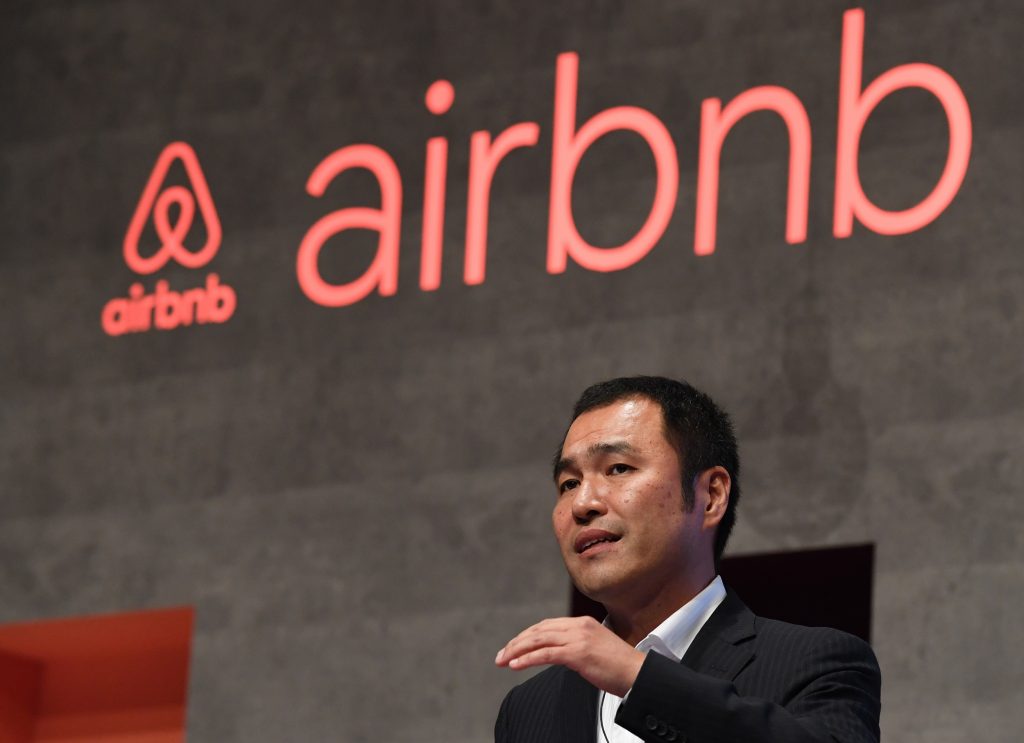 Airbnb Japan president Yasuyuki Tanabe speaks at a press conference in Tokyo on June 14, 2018. (AFP)