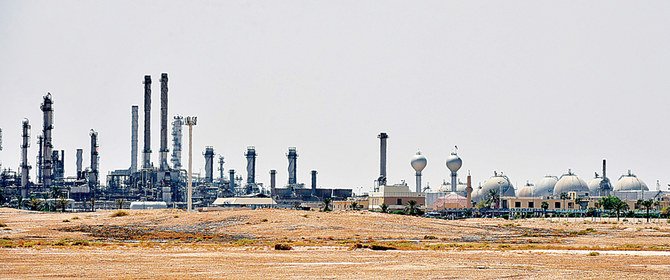 A Saudi Aramco production facility outside Riyadh. The Kingdom’s oil giant will play a central role in meeting global demand for up to 100 million barrels of crude per day in coming years, a commitment that requires huge levels of investment. (AFP)