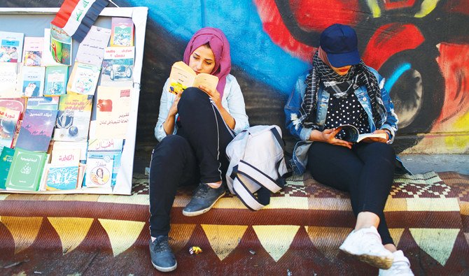Demonstrators read books during a protest in Baghdad. More than 300 people have been killed during the recent anti-government protests in the country. (Reuters)
