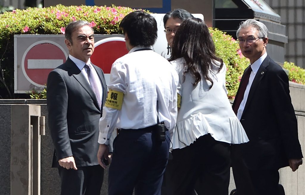 Former Nissan Motor chairman Carlos Ghosn (L) arrives at the Tokyo District Court in Tokyo on May 23, 2019. (AFP)