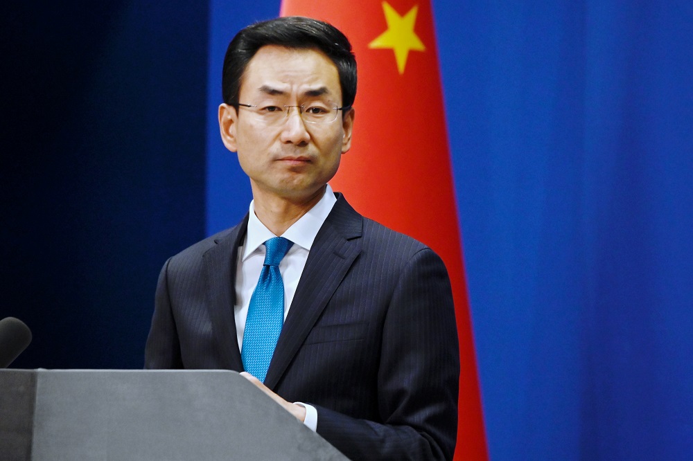 China's Ministry of Foreign Affairs spokesman Geng Shuang listens to a question during a briefing in Beijing on November 28, 2019. (AFP)
