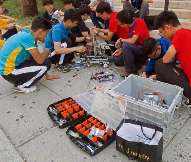FIRST Global Challenge attracts students from around the world. Above, participating teams in the robotics challenge working in DC Washington in 2017. (File/AFP)