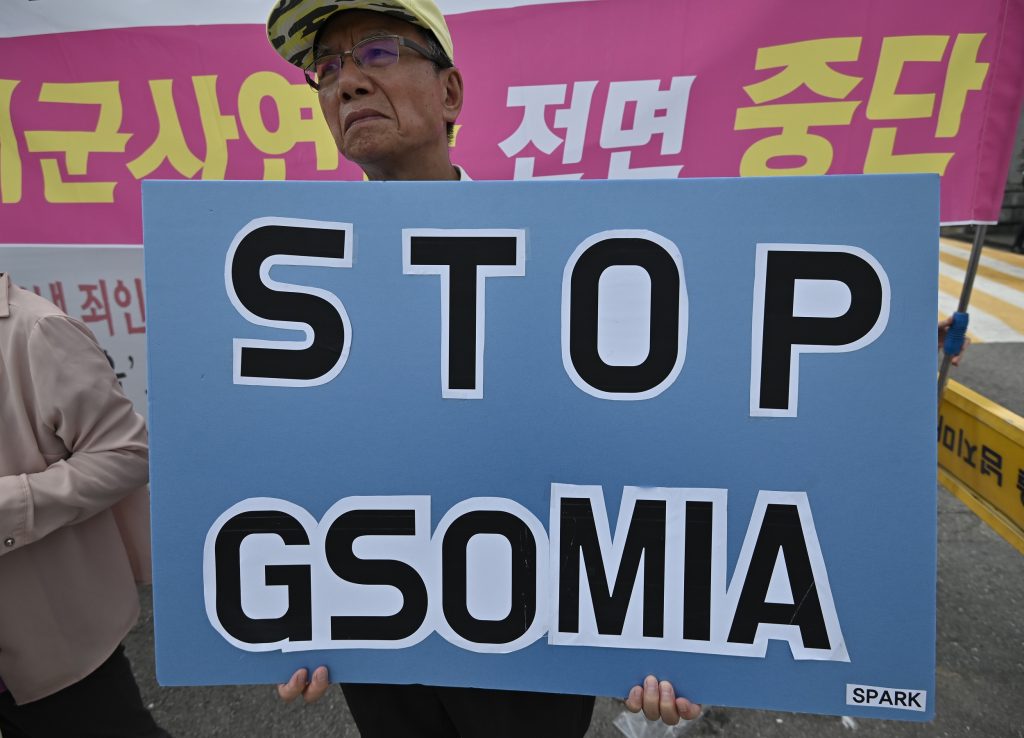 A South Korean protester holds a placard reading “Stop GSOMIA” during an anti-US rally in front of the Defense Ministry in Seoul on August 9, 2019. (AFP)