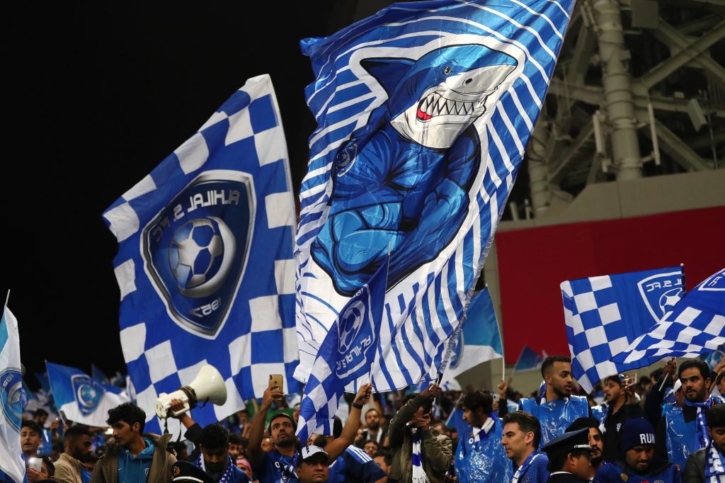 Supporters of the Saudi football team Al-Hilal wave banners before the start of the second leg of the AFC Champions League final football match between Urawa Red Diamonds and Al-Hilal at Saitama Stadium in Saitama on November 24, 2019. (AFP)