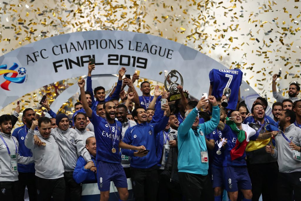 Members of Al-Hilal celebrate their victory and Asian club title on the podium following their 2-0 victory in the second leg of the AFC Champions League final football match between Japan’s Urawa Red Diamonds and Saudi’s Al-Hilal in Saitama on November 24, 2019. (AFP)