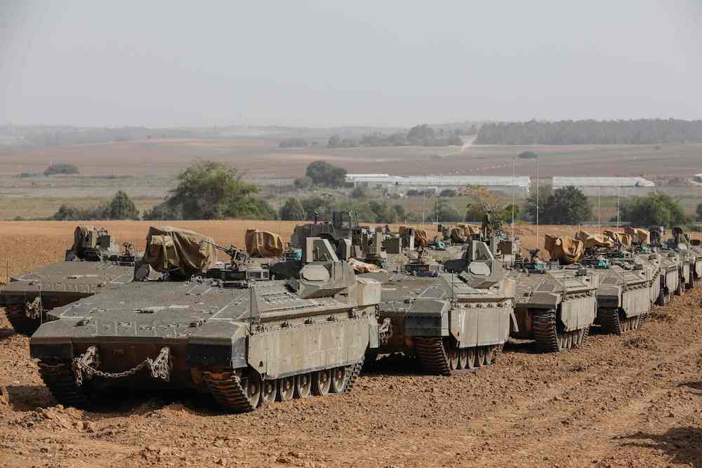 Israeli armored vehicles are pictured stationed near the border with the Gaza Strip on Nov. 13, 2019. (AFP)