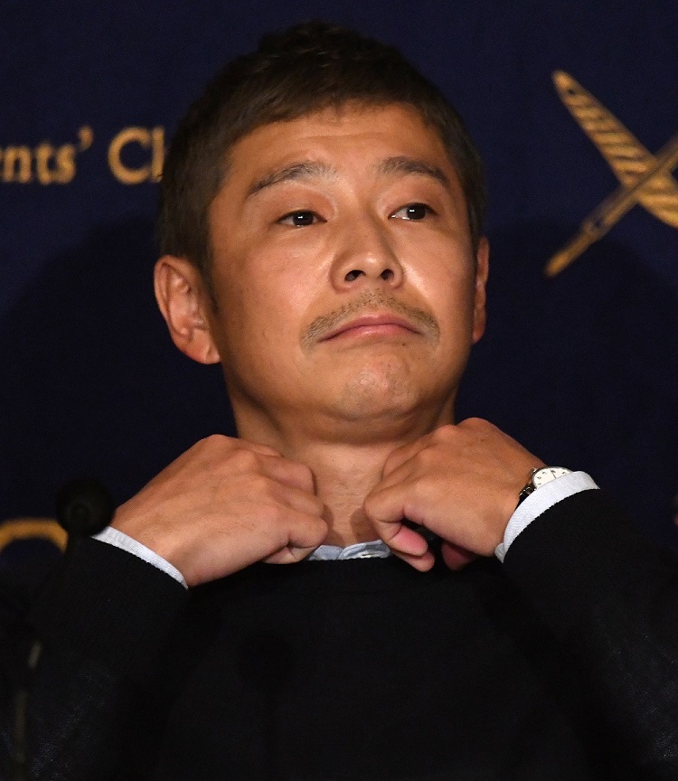 Yusaku Maezawa, in a video posted to YouTube, visited a Tokyo bank to update his bank book, which showed a new balance of around 100 billion yen ($900 million). (AFP/file)