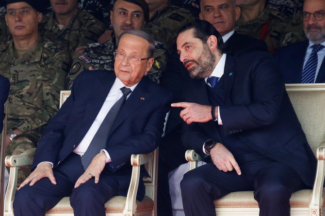 Lebanon’s caretaker Prime Minister Saad Hariri, right, urged President Michel Aoun to hold consultations to designate a new leader. (Reuters)