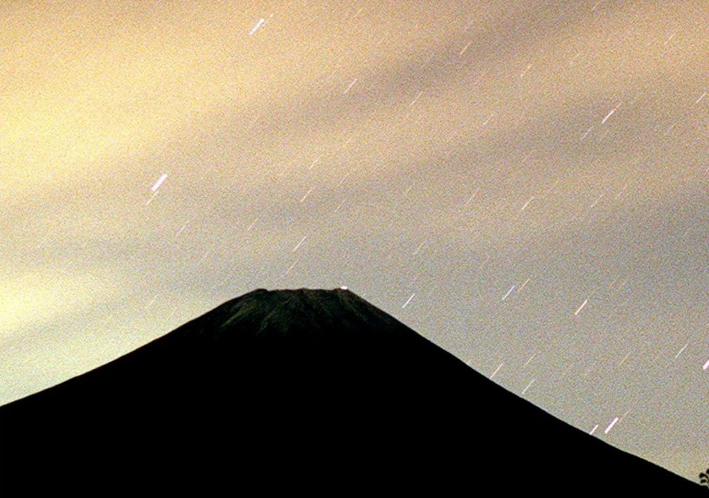 Fragments from the Leonids meteor shower over Mt. Fuji in the early hours of 18 November at Fujinomiya city in the Shizuoka prefecture of Japan. (AFP)