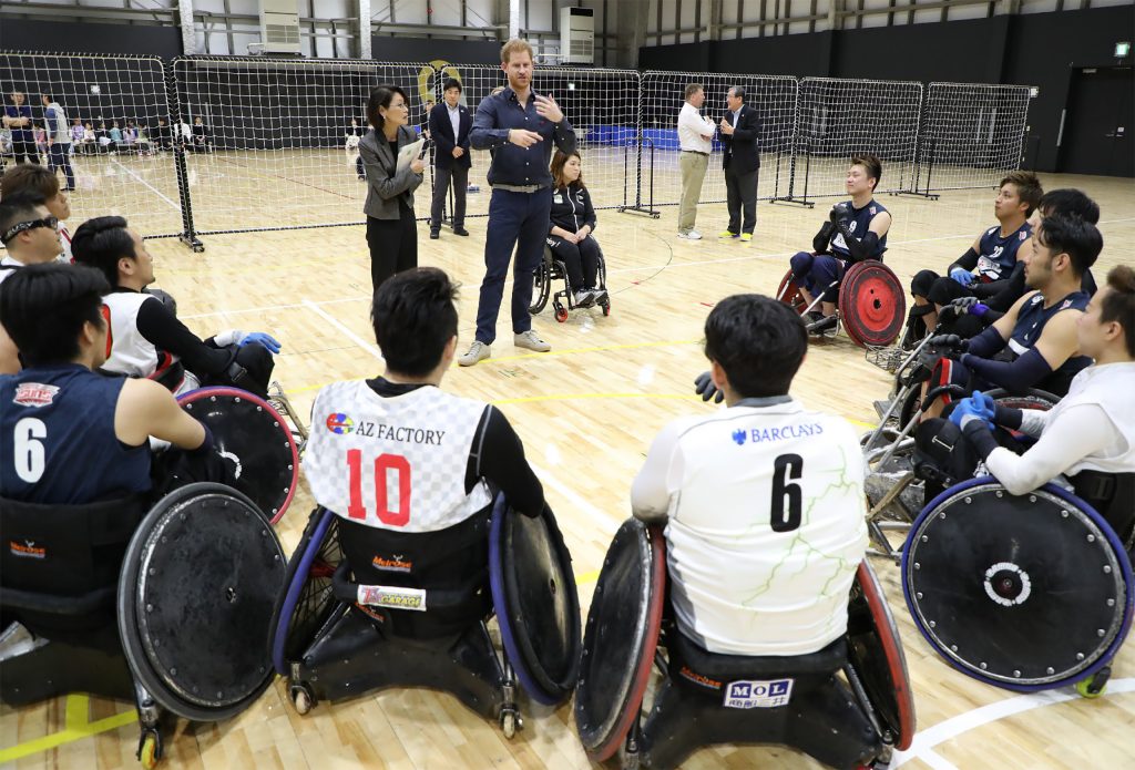 Britain’s Prince Harry (top C) speaks to athletes during his tour of the Japan Foundation's Para Arena in Tokyo on Saturday. (AFP)