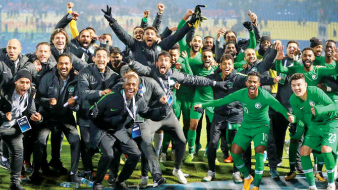 Saudi Arabia’s Green Falcons celebrate their 3-2 win against Uzbekistan at the Asian Qualifiers in Tashkent on Thursday. (Uzbekistan Football Association, Saudi Arabian Football Federation)