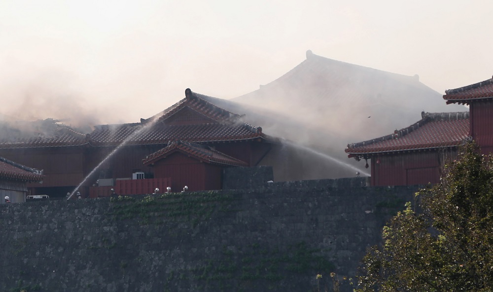 Firefighters spray water on the Shuri Castle in Naha, Okinawa prefecture, southern Japan on October 31, 2019. (AFP/file)