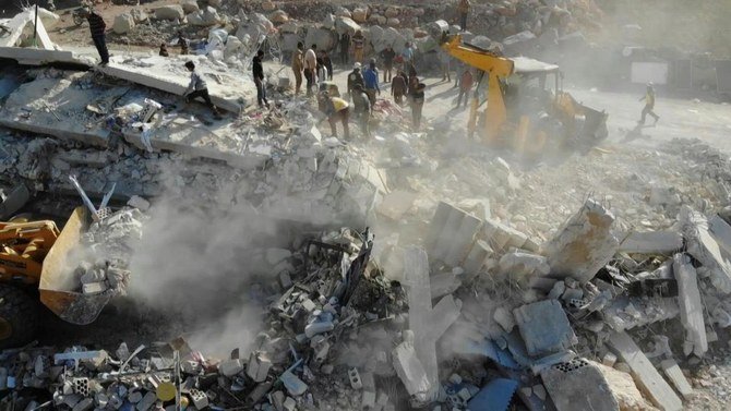 Members of the Syrian Civil Defense search for survivors after a reported airstrike by pro-government forces on the village of Shinan in the northwestern Idlib province. (File/AFP)