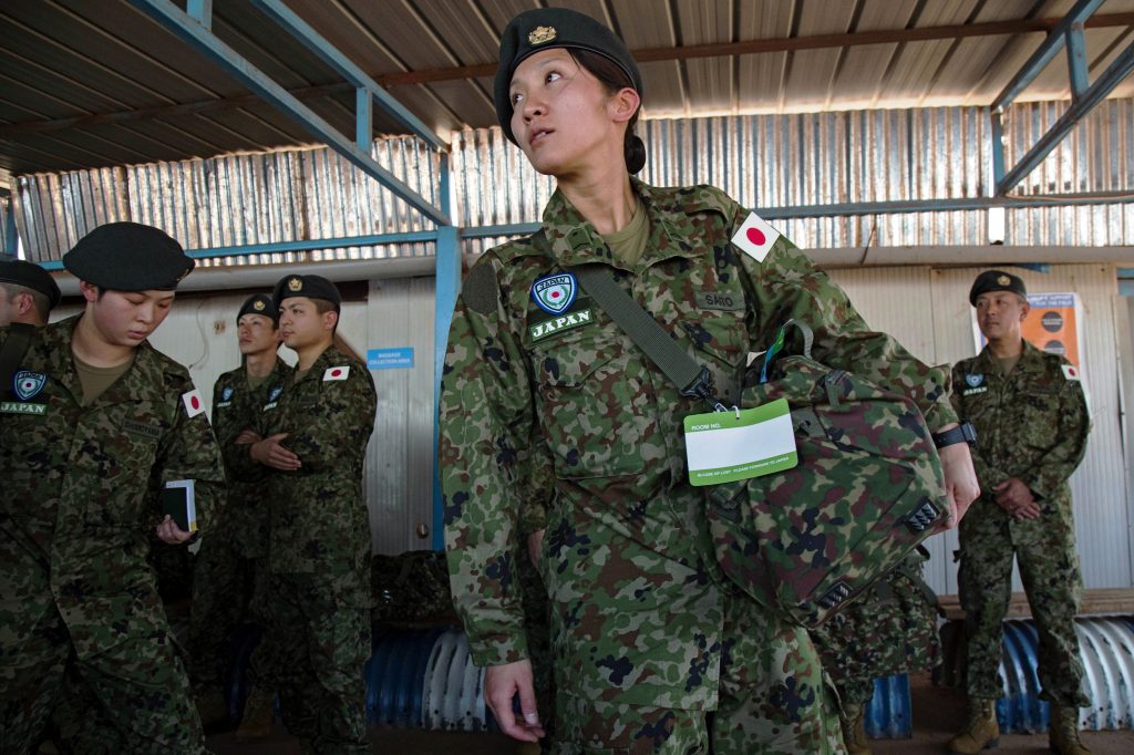 Members of the Japanese Ground Self-Defence Force wait to be taken to their base at the compound of the UN peacekeeping mission upon their arrival in Juba, South Sudan, on November 21, 2016. (File photo/AFP)