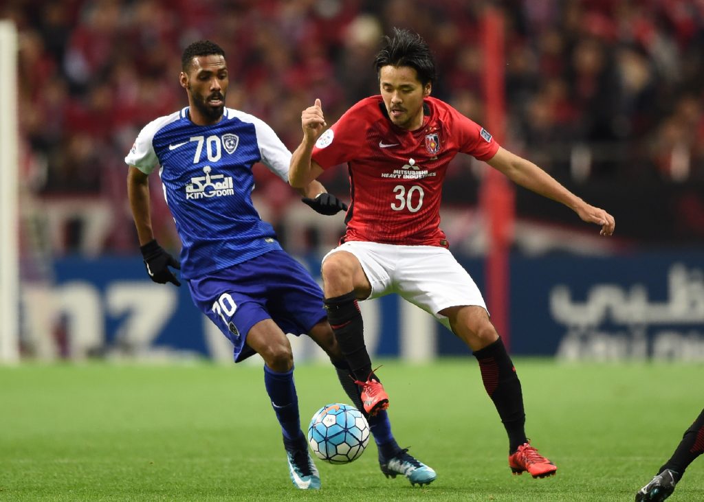 Al Hilal’s Mohammed Jahfali (L) fights for the ball with Urawa’s Shinzo Koroki during the second leg of the AFC Champions League football final in Saitama on November 25, 2017. (File photo/ AFP)