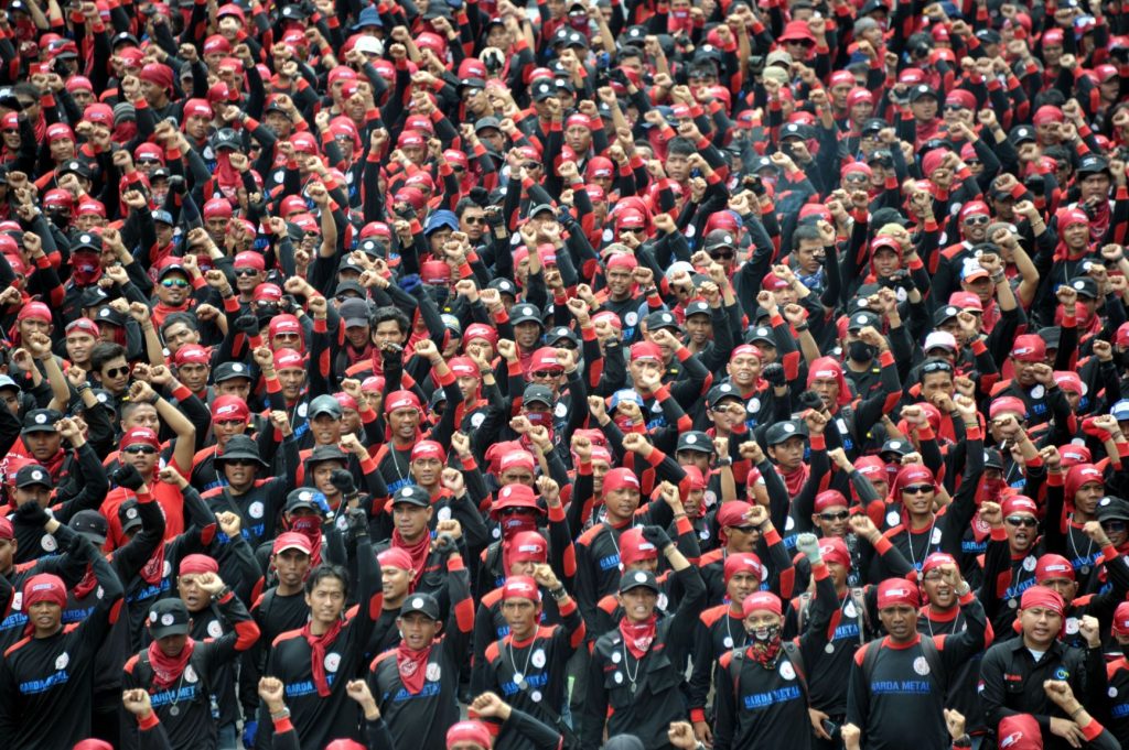 Workers from West Java march to foreign embassies, such as Japan and South Korea, in Jakarta on December 5, 2012 during a protest against the outsourcing of work by multi-national companies. (AFP)