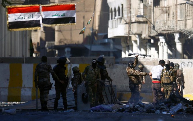 Members of Iraqi security forces are seen during the ongoing anti-government protests in Baghdad, Iraq November 8, 2019. (Reuters)