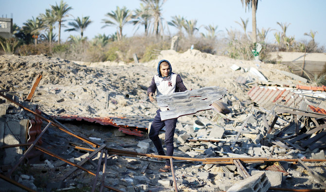 A Palestinian inspects a site that was targeted by Israeli warplanes in the southern Gaza Strip recently. (Reuters)