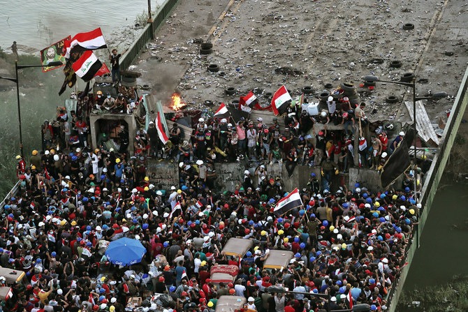 Anti-government protesters gather in Tahrir Square during ongoing protests in Baghdad, Iraq, on Oct. 31, 2019. (AP Photo/Khalid Mohammed)