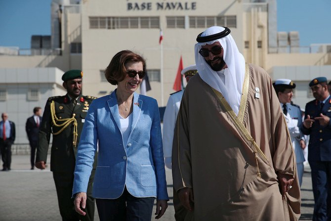 French Defense Minister Florence Parly and UAE Minister of State for Defense Mohammed Bin Ahmad Al-Bawardi speak during a military ceremony at the French Naval Base in Abu Dhabi on Nov. 24, 2019. (Reuters)