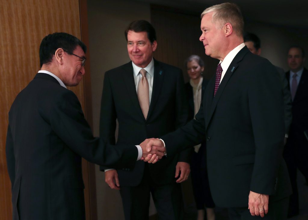 Japan's Foreign Minister Taro Kono (L) shakes hands with US special representative for North Korea Stephen Biegun (R) during a meeting in Tokyo on September 14, 2018. (AFP)