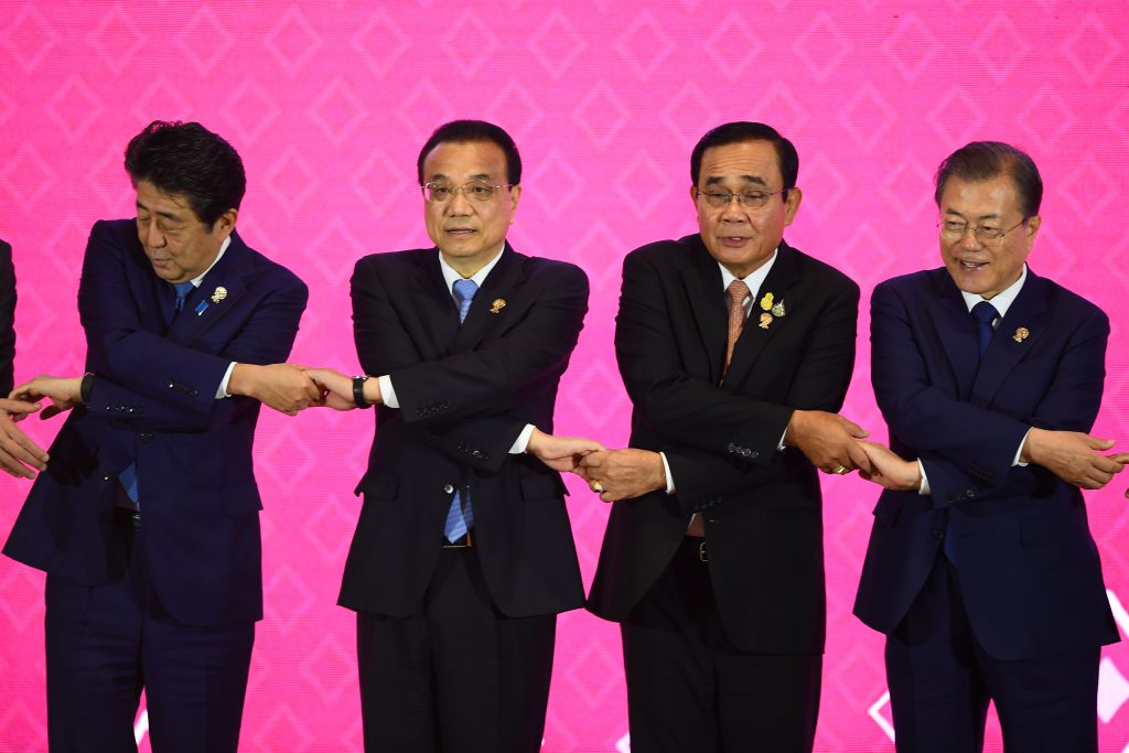 (From L to R) Japan's Prime Minister Shinzo Abe, China's Premier Li Keqiang, Thailand's Prime Minister Prayut Chan-O-Cha and South Korea's President Moon Jae-in pose for a group photo during the 22nd ASEAN Plus Three Summit in Bangkok on November 4, 2019. (AFP)