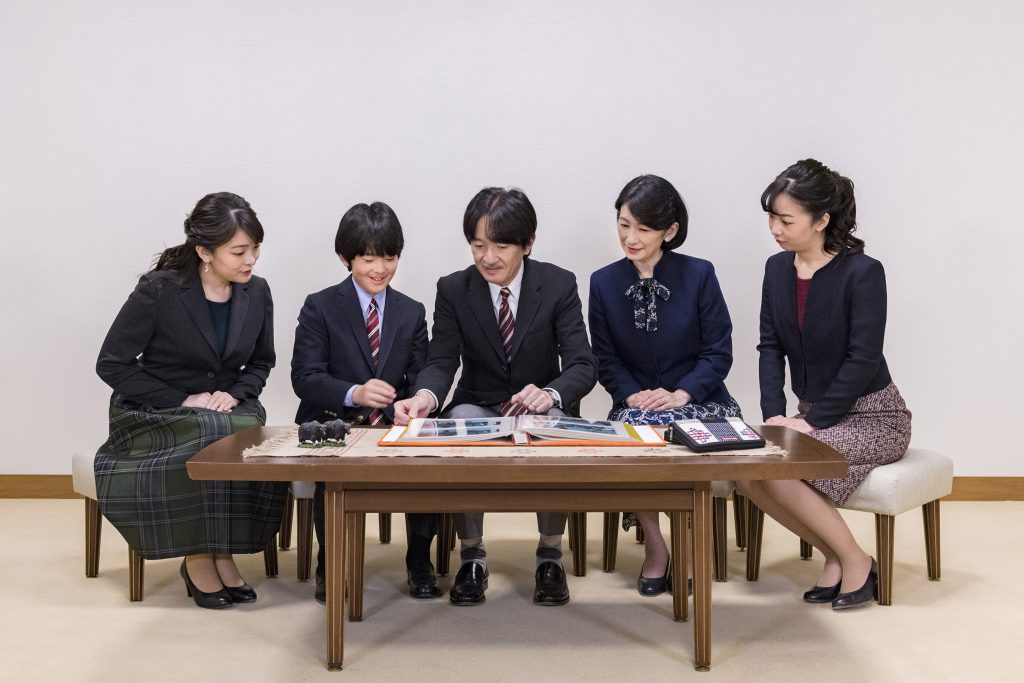 This handout photo taken on November 15, 2019 and provided by the Imperial Household Agency of Japan shows Japan's Crown Prince Akishino (C) speaking with his wife Crown Princess Kiko (2nd R) and their children, Princess Mako (L), Princess Kako (R), and Prince Hisahito (2nd L) at their residence in Tokyo. (AFP)