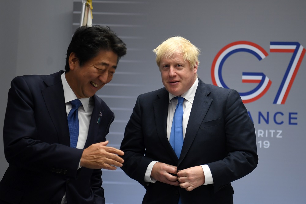 Japan's Prime Minister Shinzo Abe (left) with Prime Minister of United Kingdom Boris Johnson ahead of the Group of Seven (G7) summit meeting in Biarritz, France on August 26, 2019. (AFP/file)