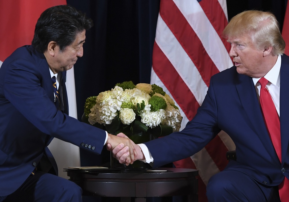 Shinzo Abe and Donald Trump reaffirmed close cooperation between their countries toward resolving the issue of North Korea's abductions of Japanese nationals decades ago and Pyongyang's nuclear and missile programs. (AFP/file)