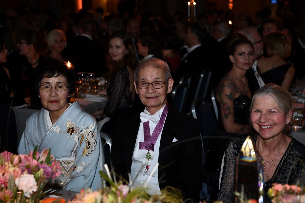 Akira Yoshino (C) and his wife, Kumiko, pose before a royal banquet to honor the laureates of the Nobel Prize 2019 following the Award ceremony in Stockholm on December 10, 2019. (AFP)