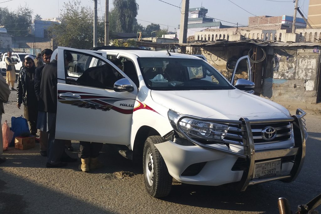 Afghan security force personnel inspect a vehicle, which was carrying Japanese doctor Tetsu Nakamura, following an attack in Jalalabad on December 4, 2019. (AFP)