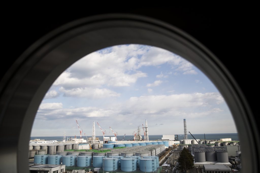 An observatory room shows (from left) unit 1 to unit 4 reactor buildings and storage tanks for contaminated water at the Tokyo Electric Power Company Fukushima Dai-ichi nuclear power plant in Okuma, Fukushima prefecture, on January 31, 2018. (AFP)