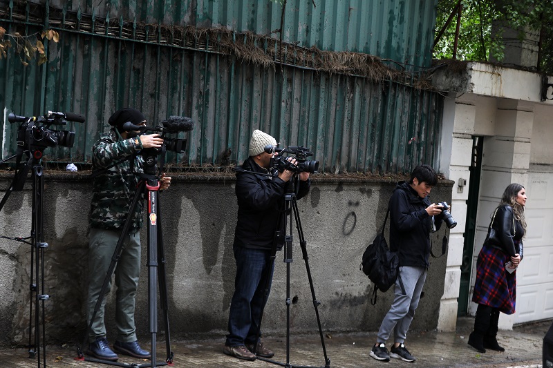 Members of the press wait in front of a house identified by court documents as belonging to former Nissan chief Carlos Ghosn in a wealthy neighborhood of the Lebanese capital Beirut on December 31, 2019. (AFP)